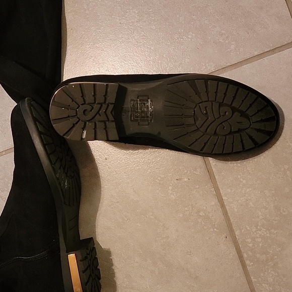 Knee-length boots with gold heel accent, side zipper, and adjustable back laces. - Picture 7 of 14